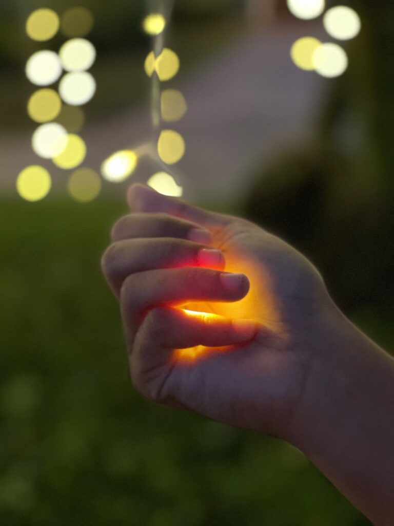 A hand with a glowing light inside